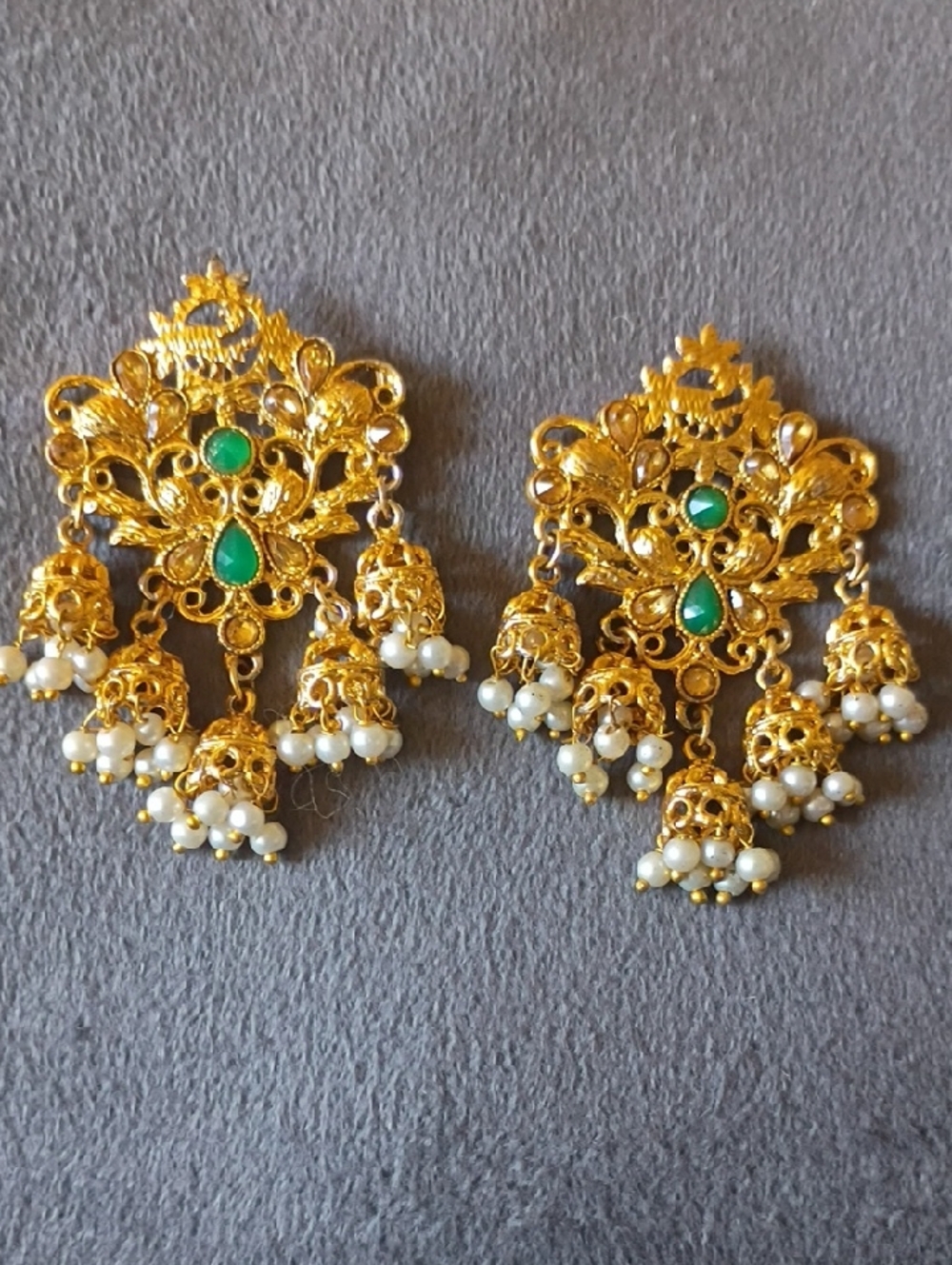 Gold-Tone Jhumka Earrings with Green Stones and Pearl Tassels